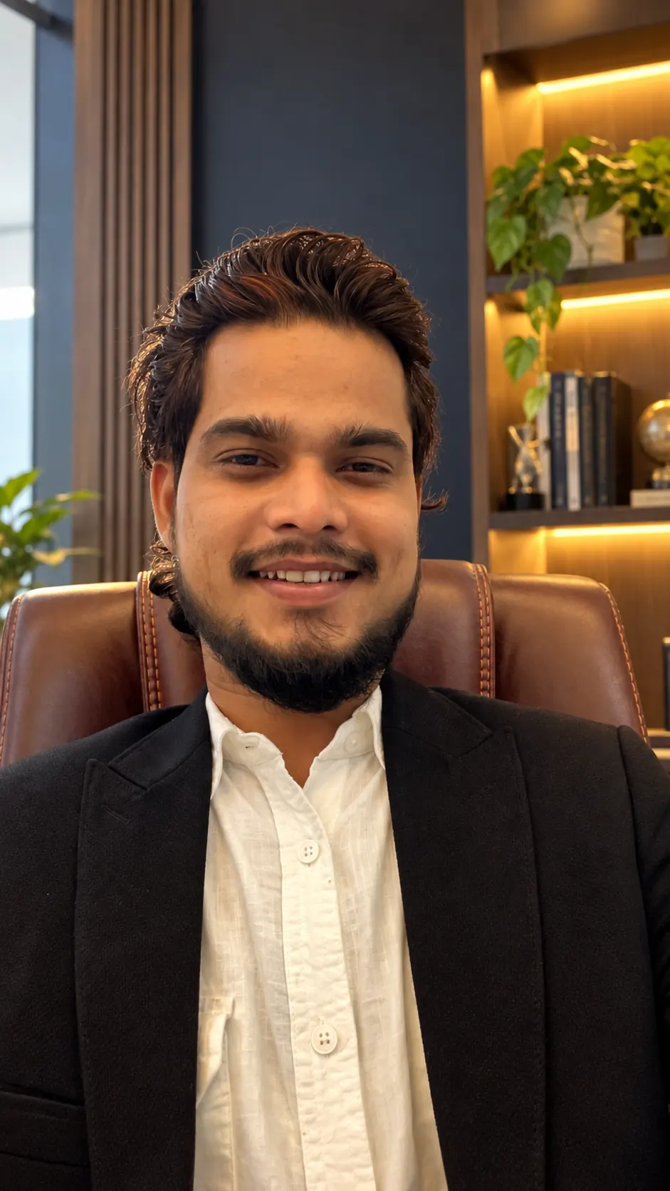 Advocate Zeeshan Ahmed in a professional office setting